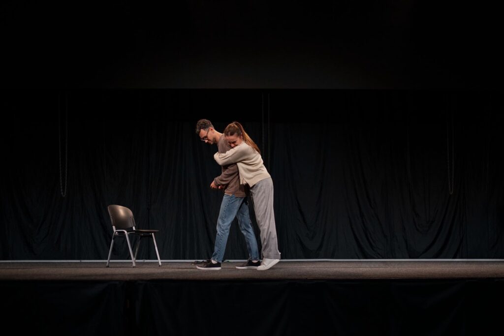 Man and woman rehearsing on the theater stage