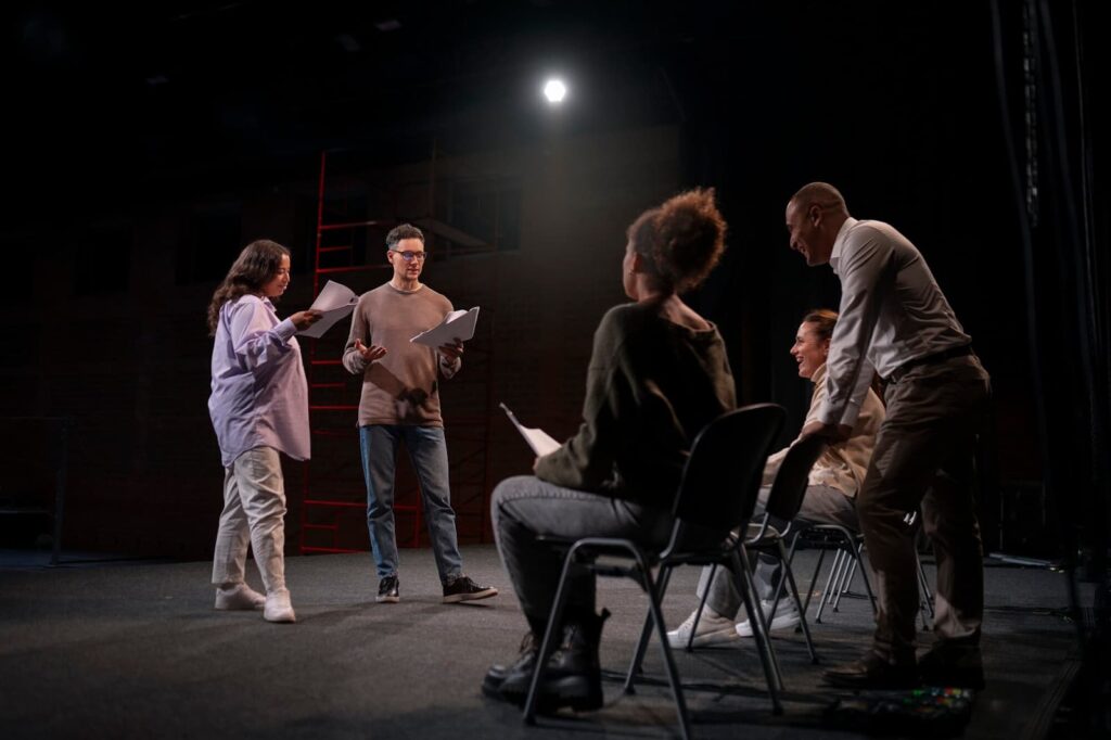 A group of people rehearsing a performance